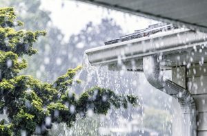 Torrential Rain Water Overflowing Roof Gutters